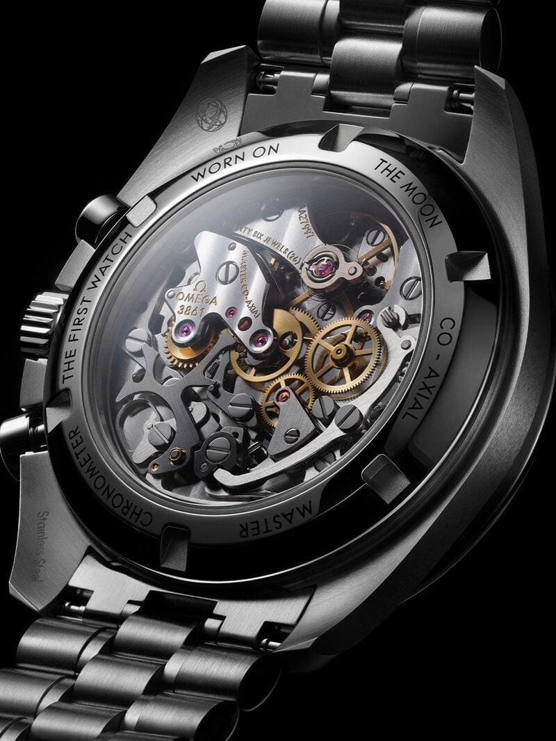 The case back of the black Omega Speedmaster Moonwatch Professional New Lacquered Reverse Panda watch displaying the movement