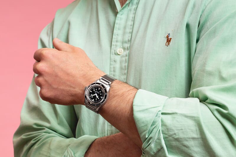 Serica 5303 black dial watch displayed on mans wrist