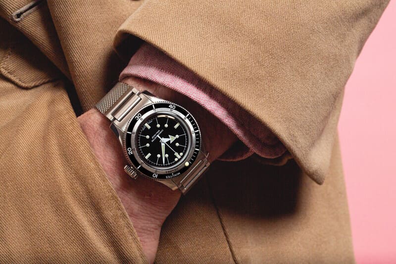 Serica 5303 Black dial worn on mans wrist with his hand in his pocket